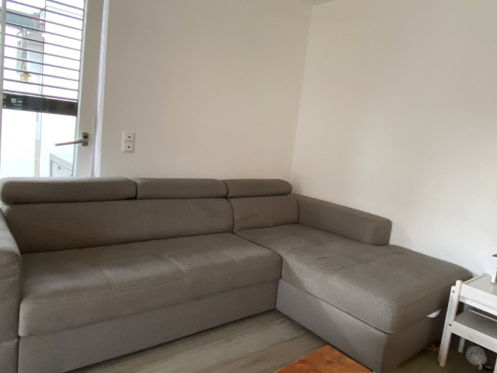 Graues ecksofa